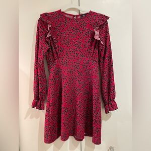 River Island red long ruffle sleeve dress with black floral design.